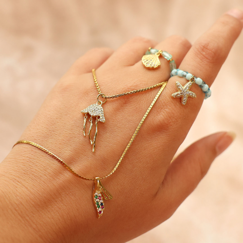 Crea bonitos collares y anillos con colgantes met&aacute;licos TQ de lat&oacute;n